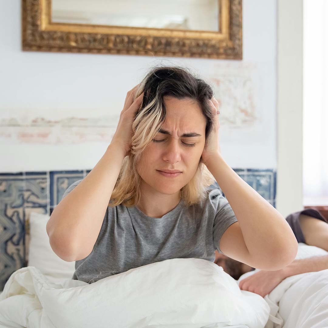 Tired person struggling to wake up in the morning, showing the impact of poor sleep.