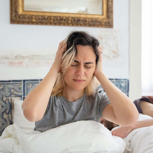 Tired person struggling to wake up in the morning, showing the impact of poor sleep.